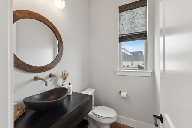 bathroom featuring toilet and sink