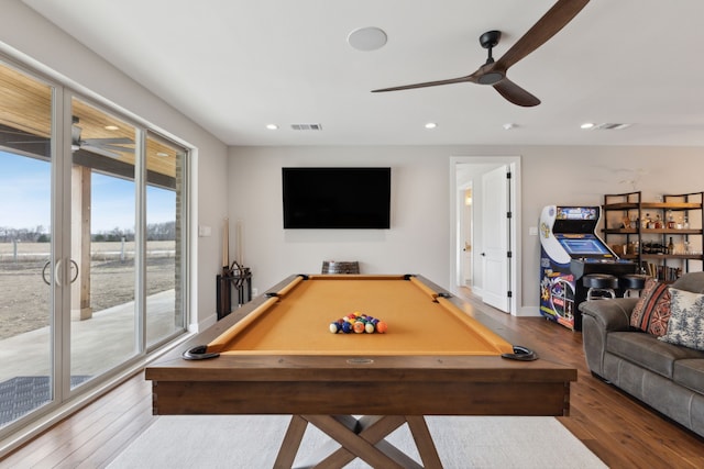 recreation room featuring recessed lighting, a ceiling fan, baseboards, visible vents, and wood-type flooring