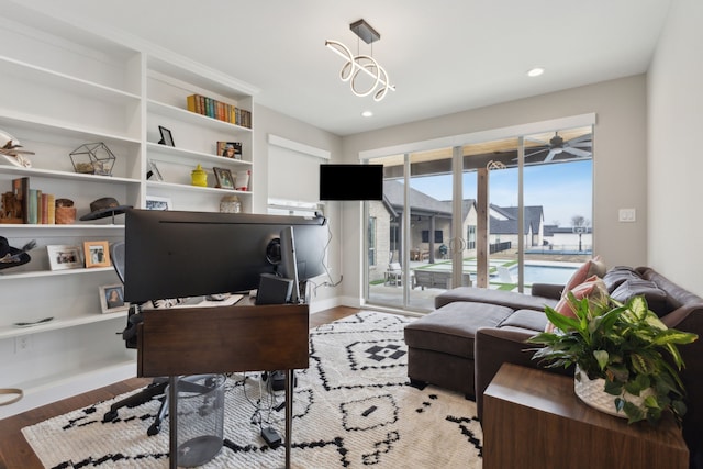 office area featuring light wood-type flooring, baseboards, and recessed lighting