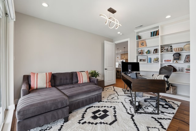 office with light wood finished floors, recessed lighting, visible vents, and an inviting chandelier