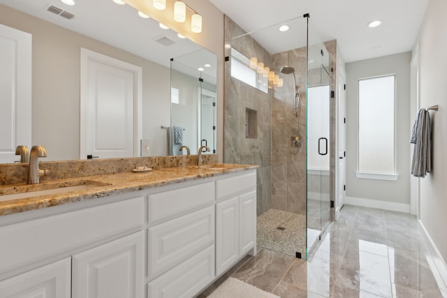 bathroom featuring vanity and walk in shower