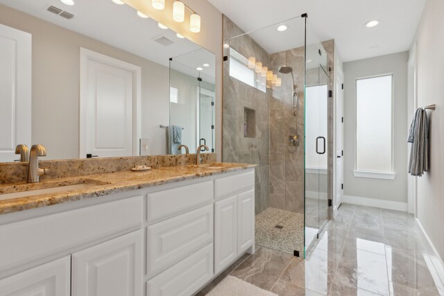 bathroom with vanity, toilet, and tile patterned flooring