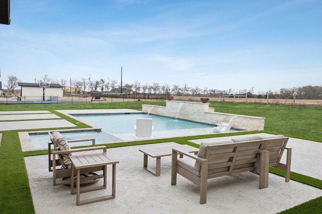 view of swimming pool featuring a yard, a fenced in pool, a patio, and fence