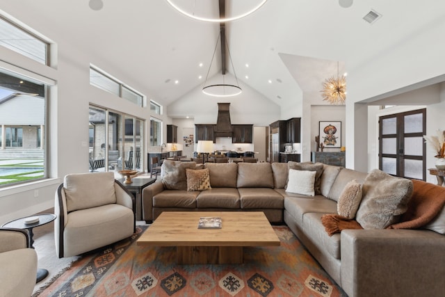 living area featuring high vaulted ceiling, visible vents, beamed ceiling, and recessed lighting