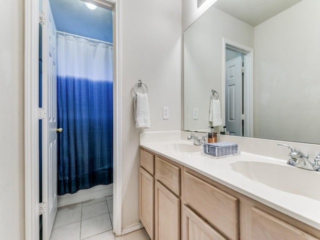 bathroom featuring tile patterned flooring, vanity, and a shower with shower curtain