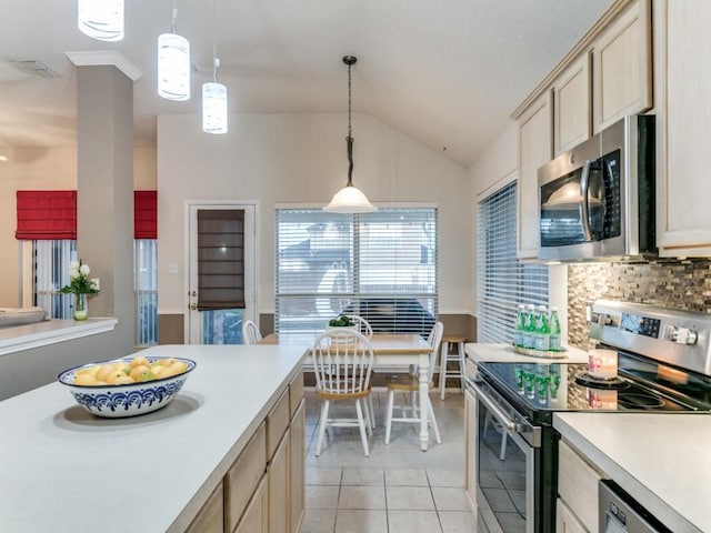 kitchen featuring pendant lighting, decorative backsplash, light tile patterned floors, stainless steel appliances, and light brown cabinets