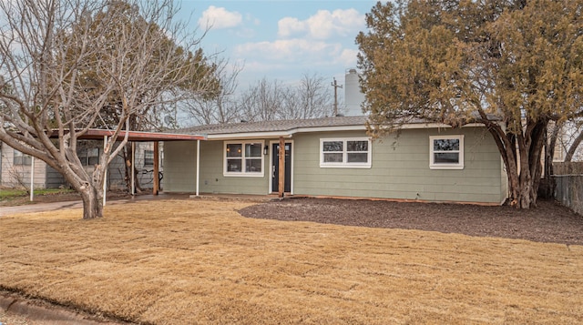 ranch-style house with a front yard and a carport