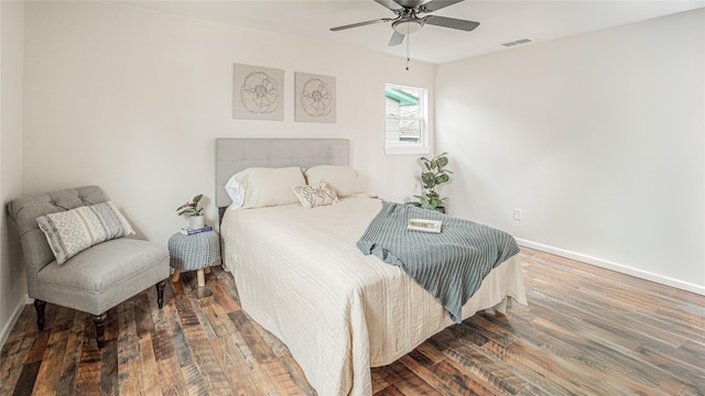 bedroom featuring dark wood-type flooring and ceiling fan