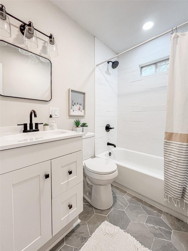 full bathroom with vanity, toilet, and shower / bath combo