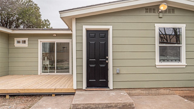 doorway to property featuring a wooden deck