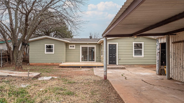 rear view of house with a patio and a deck