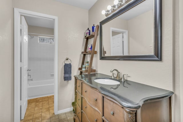 bathroom with tiled shower / bath combo, vanity, and tile patterned floors