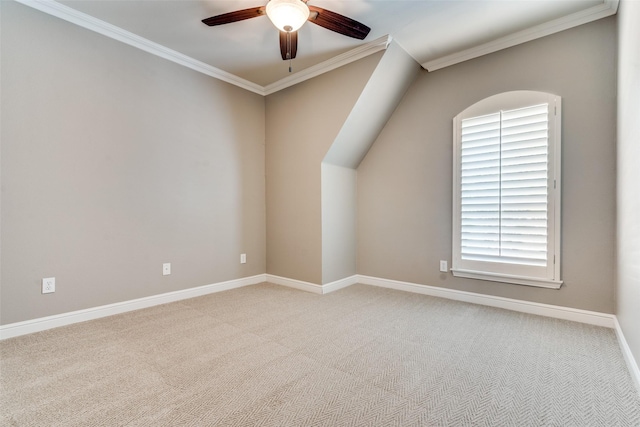 empty room featuring light colored carpet, ornamental molding, and ceiling fan