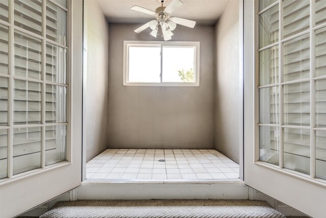 interior space featuring ceiling fan