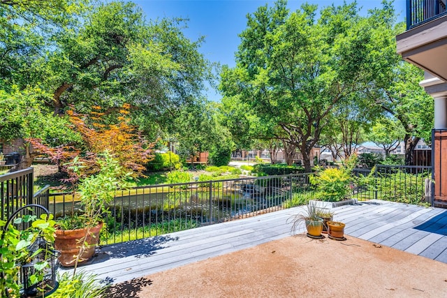 view of patio / terrace with a deck with water view