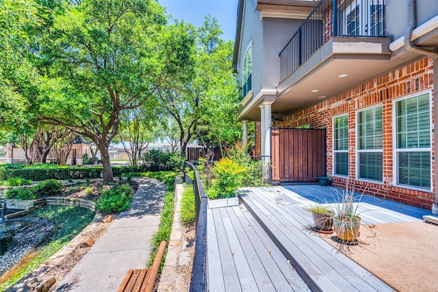 wooden deck with a patio