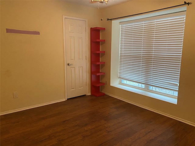 unfurnished bedroom featuring dark wood-type flooring