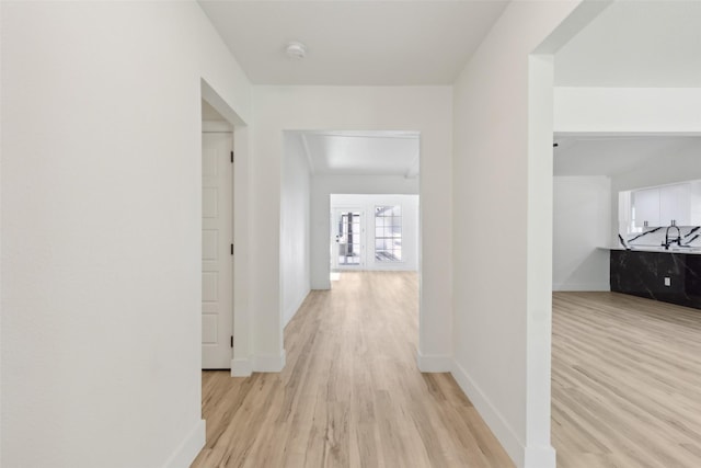 corridor featuring light wood-type flooring