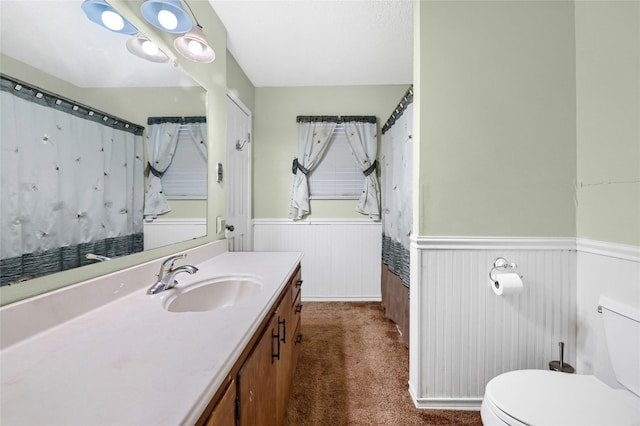 bathroom with vanity and toilet