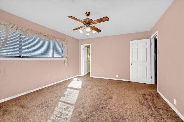 empty room featuring ceiling fan and carpet flooring