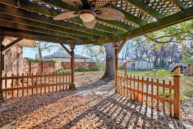 view of patio / terrace featuring ceiling fan and a pergola