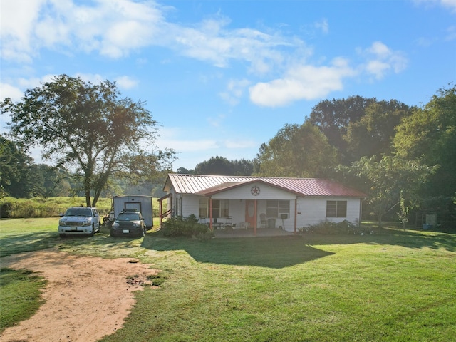 view of front of house with a porch and a front lawn