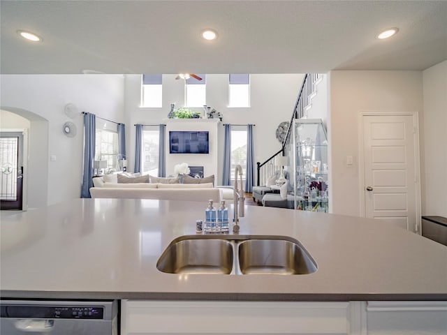 kitchen with dishwasher, sink, and ceiling fan