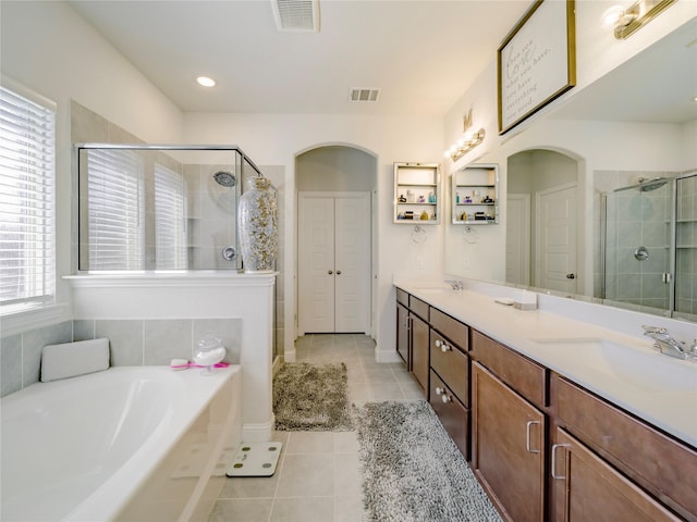 bathroom with vanity, separate shower and tub, and tile patterned floors