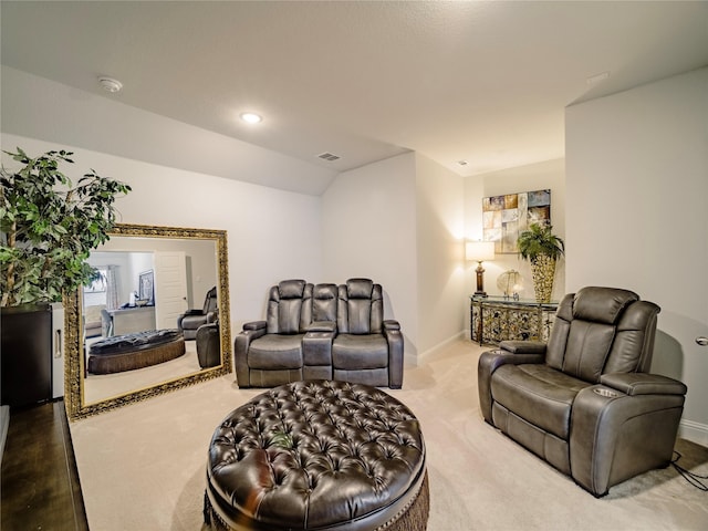 living room with lofted ceiling and carpet floors