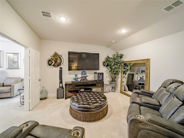 carpeted living room featuring lofted ceiling