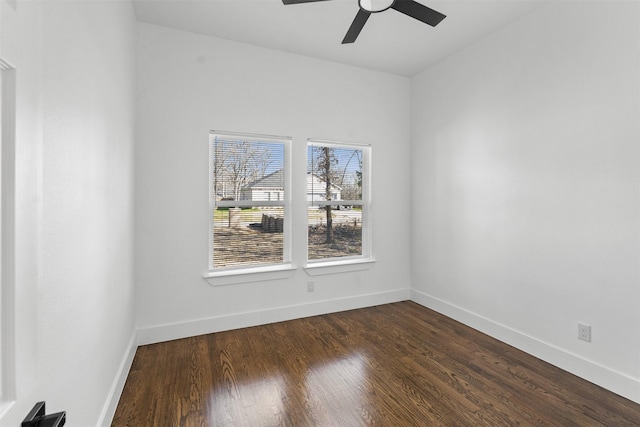 unfurnished room with dark wood-type flooring and ceiling fan