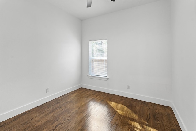 unfurnished room featuring dark hardwood / wood-style flooring and ceiling fan