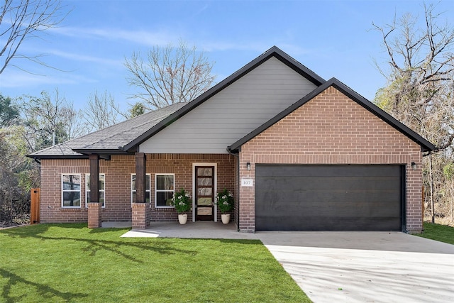 view of front of property featuring a garage and a front yard