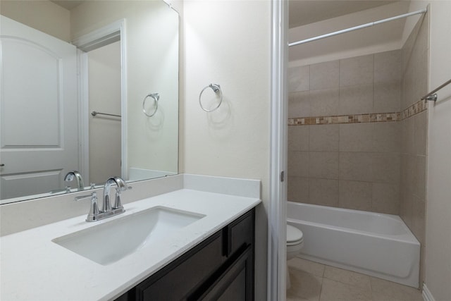 full bathroom with toilet, bathing tub / shower combination, vanity, and tile patterned floors