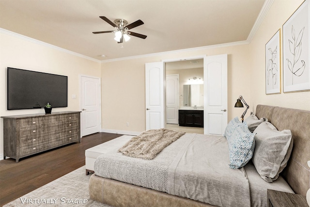 bedroom featuring dark wood-style floors, ensuite bathroom, ornamental molding, a sink, and baseboards