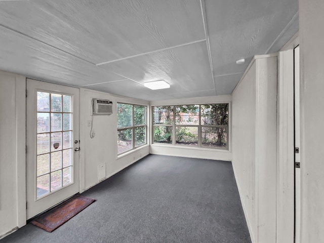 interior space with plenty of natural light and a wall unit AC