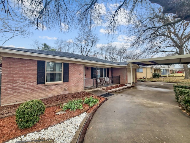 ranch-style house with a carport