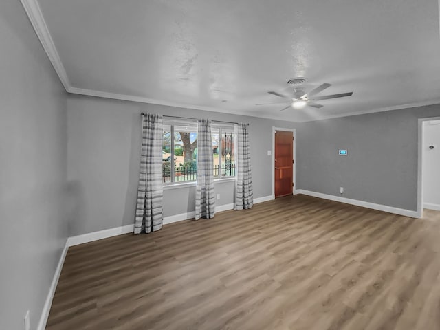 unfurnished room featuring ornamental molding, hardwood / wood-style floors, and ceiling fan