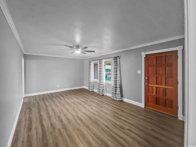 unfurnished living room with hardwood / wood-style flooring, ceiling fan, and crown molding