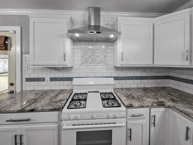 kitchen featuring tasteful backsplash, white cabinets, exhaust hood, and white range with gas stovetop