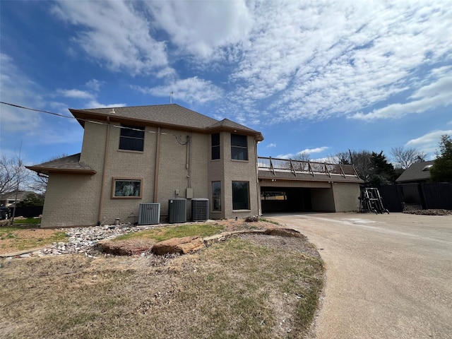 view of side of property with central AC unit