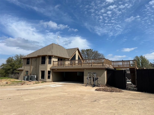 view of front of home with central AC and a deck