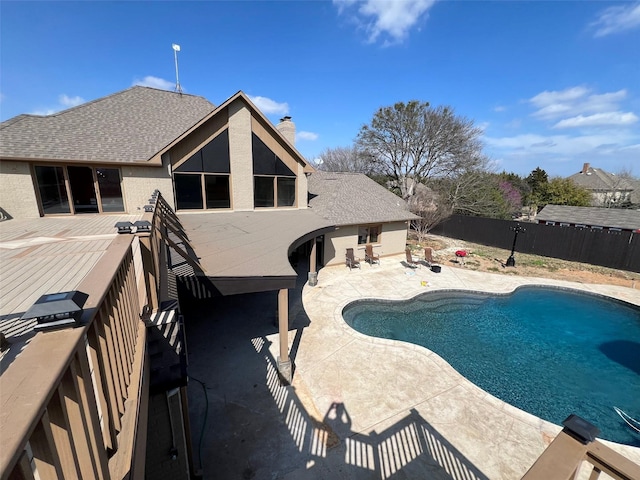 view of swimming pool featuring a patio area