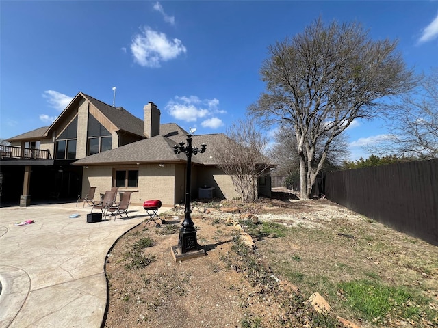 back of property featuring a patio and cooling unit