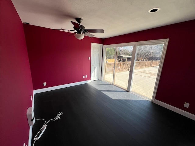 spare room featuring hardwood / wood-style flooring and ceiling fan