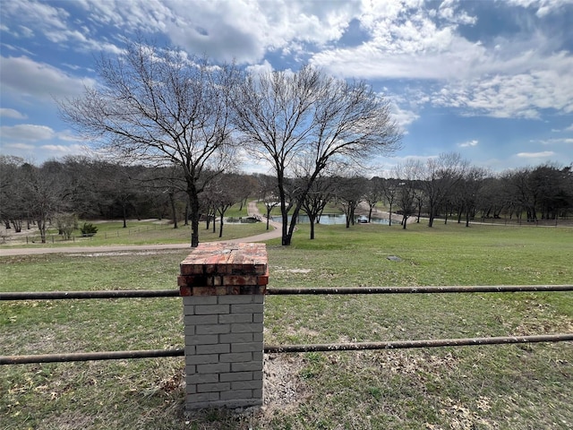 view of yard with a rural view