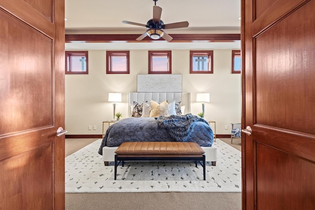 bedroom with ceiling fan and carpet flooring