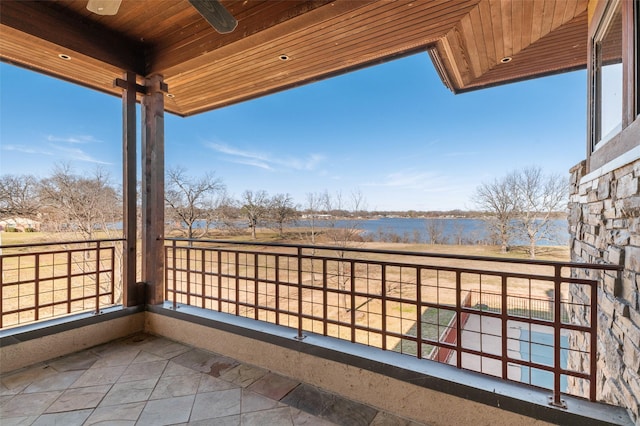 balcony featuring a rural view and ceiling fan