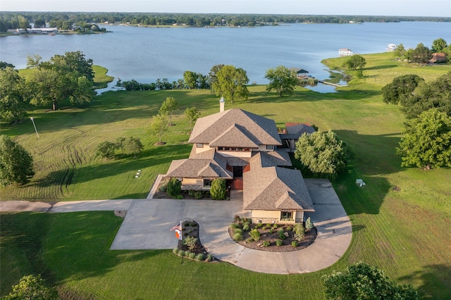 aerial view with a rural view and a water view