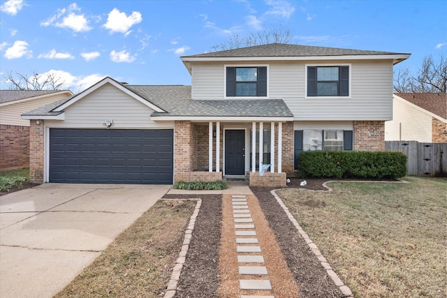 view of front property featuring a garage and a front lawn